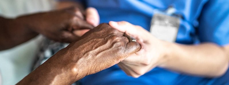EMPOWERING FAMILIES WITH COMPREHENSIVE IN-HOME CARE 11 SENIOR AND CAREGIVER HOLDING HANDS