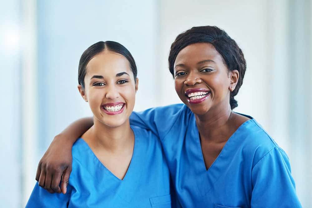 Portrait of two female nurses standing in a hospital